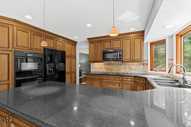 6588 White Pines Dr, Brighton, MI 48116 - kitchen featuring black appliances, a sink, brown cabinetry, backsplash, and recessed lighting