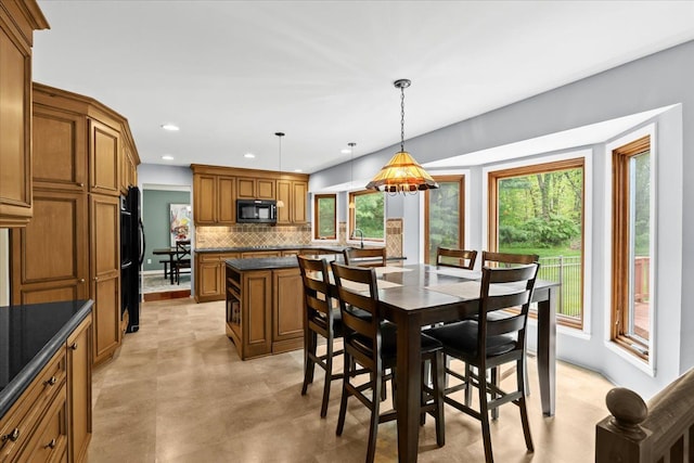 6588 White Pines Dr, Brighton, MI 48116 - dining area with recessed lighting and concrete floors