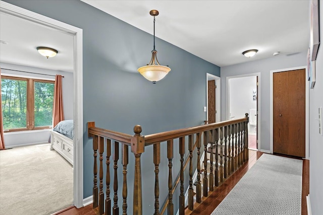 6588 White Pines Dr, Brighton, MI 48116 - hall with an upstairs landing, baseboards, and wood finished floors