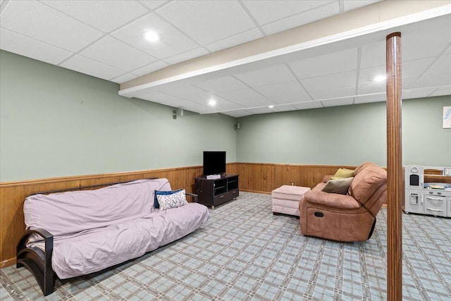6588 White Pines Dr, Brighton, MI 48116 - living area featuring wainscoting, carpet, a paneled ceiling, wood walls, and recessed lighting