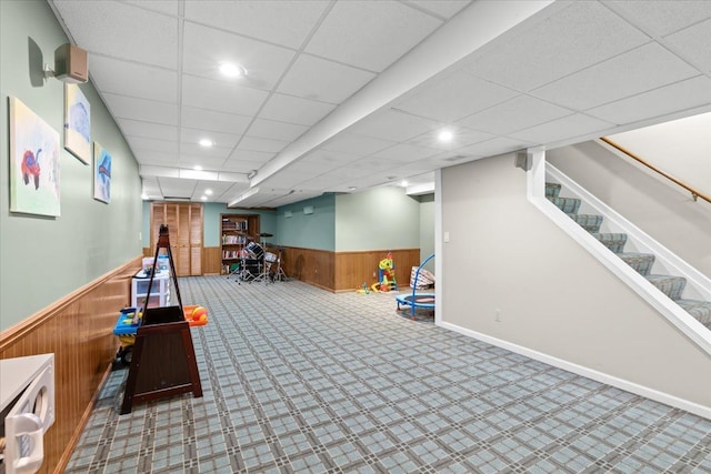 6588 White Pines Dr, Brighton, MI 48116 - playroom with a wainscoted wall, carpet, wooden walls, recessed lighting, and a drop ceiling