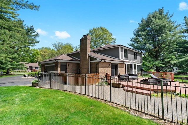 6588 White Pines Dr, Brighton, MI 48116 - view of front of house featuring brick siding, a chimney, and roof with shingles