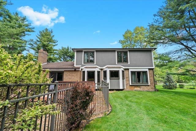 6588 White Pines Dr, Brighton, MI 48116 - rear view of property with brick siding, a lawn, and a chimney
