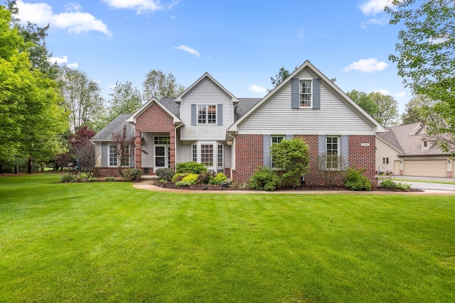 traditional-style home with brick siding and a front lawn