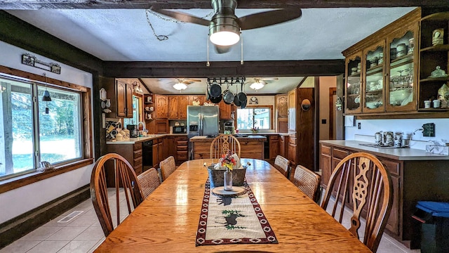 7884 N Saint Helen Rd, Saint Helen, MI 48656 - dining room with light tile patterned flooring, a ceiling fan, and healthy amount of natural light