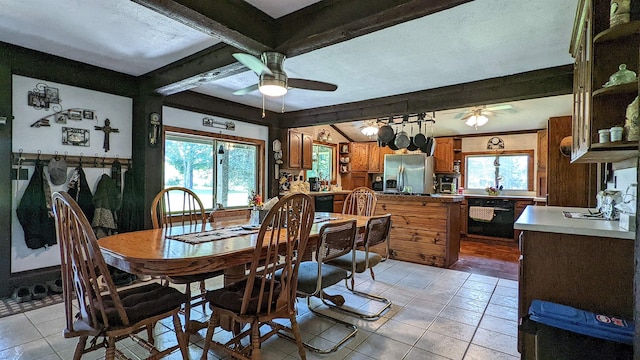 7884 N Saint Helen Rd, Saint Helen, MI 48656 - dining area featuring ceiling fan, light tile patterned floors, and beam ceiling