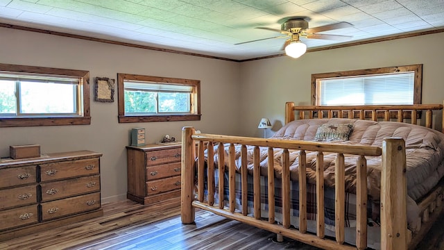 7884 N Saint Helen Rd, Saint Helen, MI 48656 - bedroom featuring wood finished floors, ornamental molding, and ceiling fan
