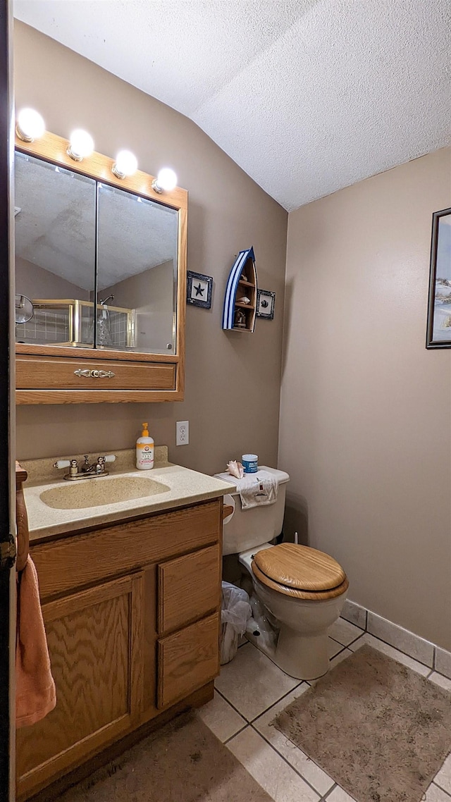 7884 N Saint Helen Rd, Saint Helen, MI 48656 - bathroom with tile patterned flooring, toilet, lofted ceiling, vanity, and a textured ceiling