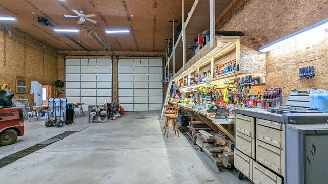 7884 N Saint Helen Rd, Saint Helen, MI 48656 - garage with a workshop area