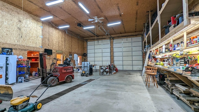7884 N Saint Helen Rd, Saint Helen, MI 48656 - garage featuring a workshop area and ceiling fan