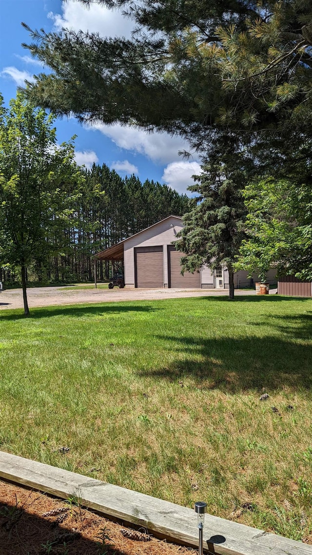 7884 N Saint Helen Rd, Saint Helen, MI 48656 - view of front of house featuring a front yard and driveway