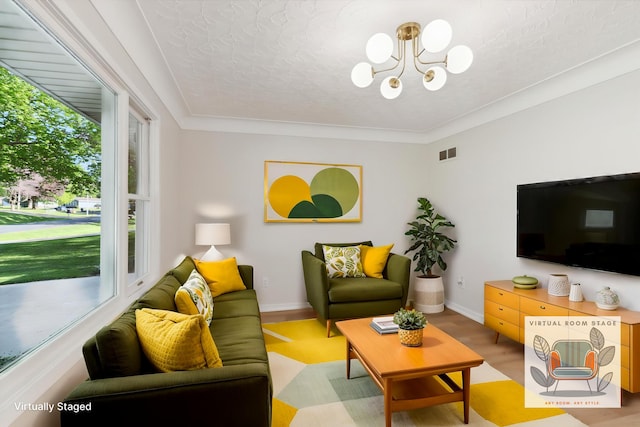 5082 Patland Dr, Kalamazoo, MI 49009 - living area with a chandelier and baseboards