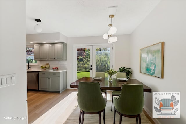 5082 Patland Dr, Kalamazoo, MI 49009 - dining space with light wood-type flooring and french doors