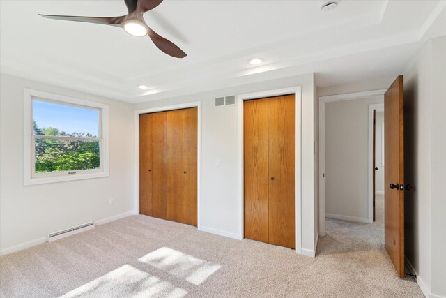 5082 Patland Dr, Kalamazoo, MI 49009 - unfurnished bedroom with a baseboard heating unit, multiple closets, carpet, recessed lighting, and ceiling fan