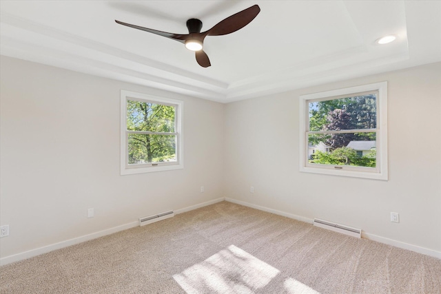 5082 Patland Dr, Kalamazoo, MI 49009 - spare room featuring a raised ceiling, healthy amount of natural light, ceiling fan, and carpet