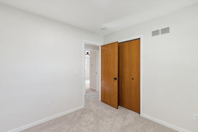 5082 Patland Dr, Kalamazoo, MI 49009 - unfurnished bedroom with light carpet, baseboards, and a closet