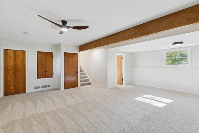 5082 Patland Dr, Kalamazoo, MI 49009 - carpeted spare room with stairs, baseboards, and ceiling fan