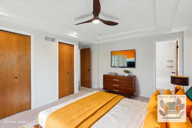 5082 Patland Dr, Kalamazoo, MI 49009 - bedroom with a raised ceiling, baseboards, carpet flooring, multiple closets, and ceiling fan
