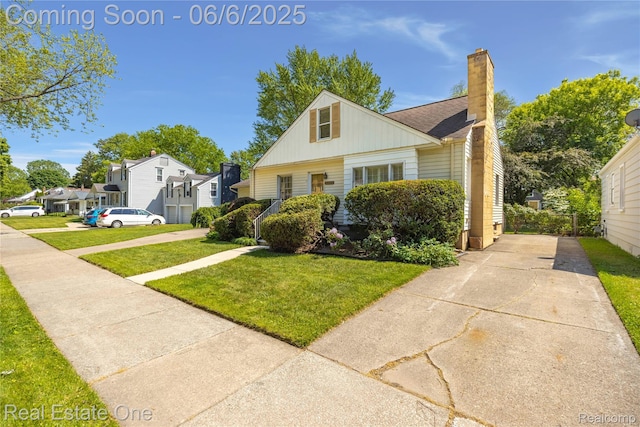 2209 Ridgemont Rd, Grosse Pointe Woods, MI 48236 - bungalow-style house with a chimney and a front yard