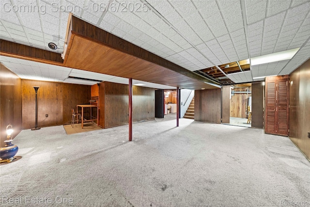 2209 Ridgemont Rd, Grosse Pointe Woods, MI 48236 - finished basement with stairs, wood walls, and carpet floors