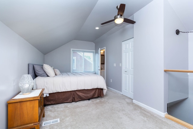 bedroom with lofted ceiling, light carpet, baseboards, and ceiling fan