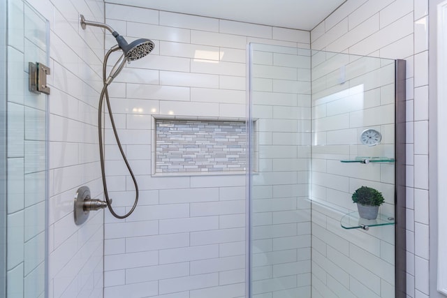bathroom with a shower stall