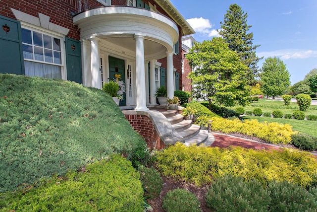 736 Chicago Blvd, Detroit, MI 48202 - view of exterior entry with covered porch and brick siding
