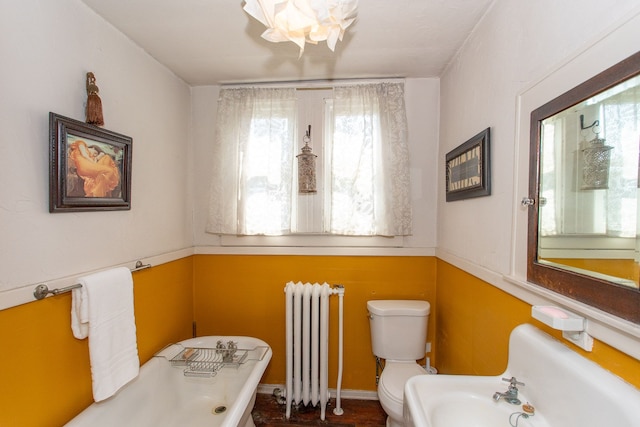 736 Chicago Blvd, Detroit, MI 48202 - full bath featuring radiator heating unit, healthy amount of natural light, a freestanding bath, and toilet