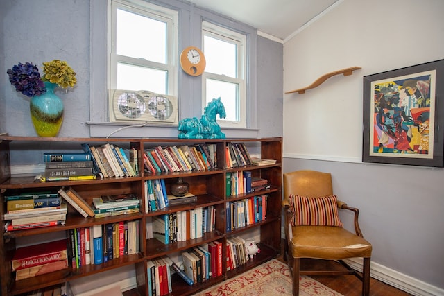 736 Chicago Blvd, Detroit, MI 48202 - living area featuring crown molding, wood finished floors, and baseboards