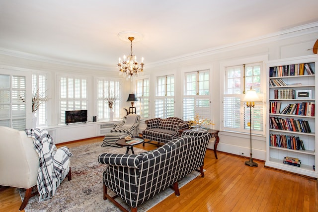 736 Chicago Blvd, Detroit, MI 48202 - living room featuring a chandelier, hardwood / wood-style flooring, ornamental molding, and plenty of natural light