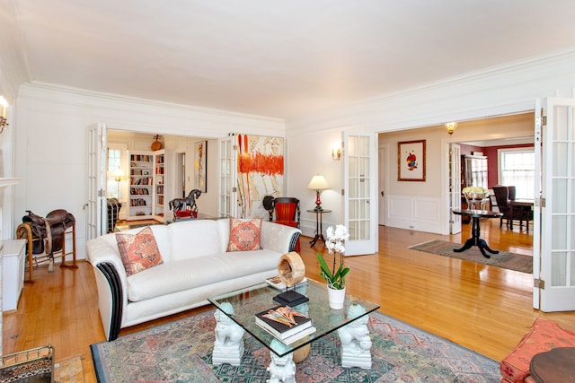 736 Chicago Blvd, Detroit, MI 48202 - living area with french doors, ornamental molding, light wood-type flooring, and a decorative wall