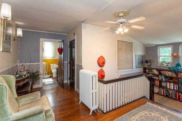 736 Chicago Blvd, Detroit, MI 48202 - corridor with radiator, wood finished floors, vaulted ceiling, an upstairs landing, and ornamental molding