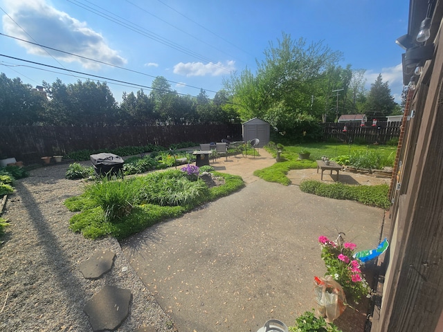 26541 Warner Ave, Warren, MI 48091 - fenced backyard with a patio, a shed, and an outdoor structure