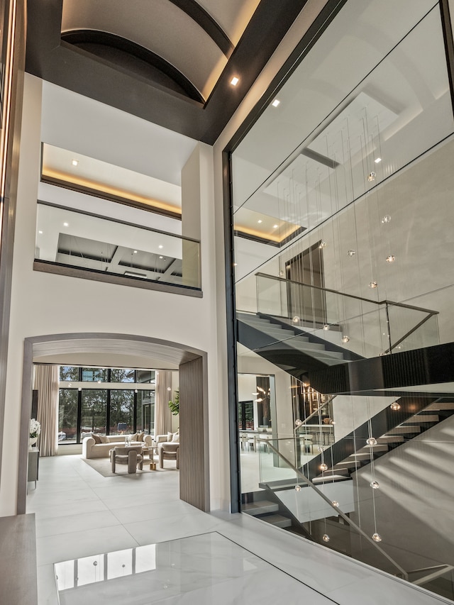 lobby with a towering ceiling and recessed lighting
