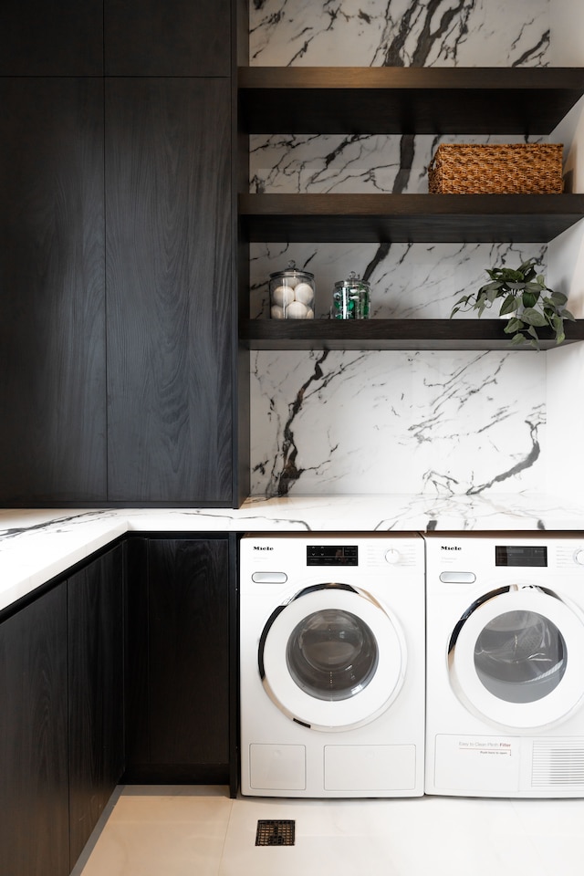 washroom with independent washer and dryer
