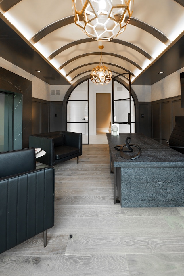 community lobby featuring lofted ceiling