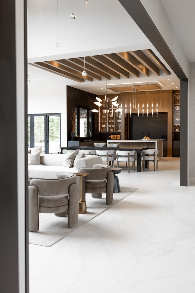 common area with beamed ceiling