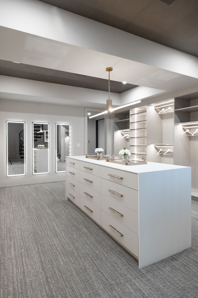 walk in closet featuring carpet