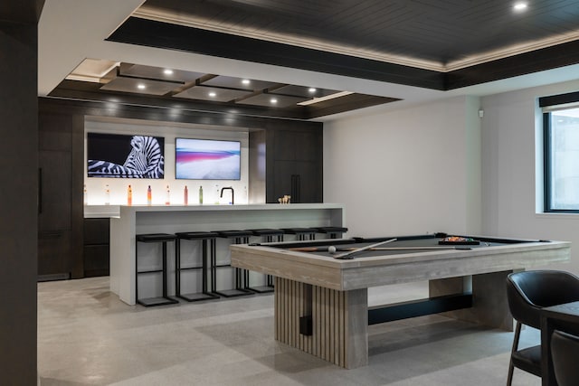 rec room with billiards, ornamental molding, wet bar, finished concrete floors, and recessed lighting