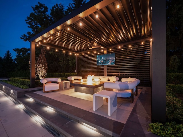 view of patio / terrace featuring an outdoor fire pit