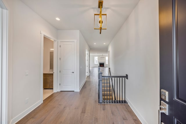 5636 Suffolk Ct, West Bloomfield, MI 48322 - hallway with an upstairs landing, wood finished floors, baseboards, and recessed lighting
