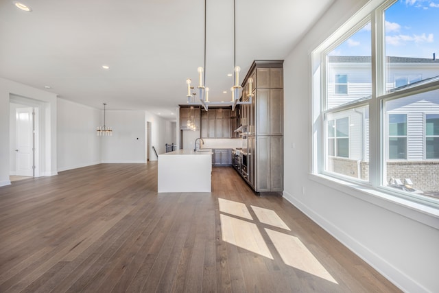5636 Suffolk Ct, West Bloomfield, MI 48322 - kitchen featuring a chandelier, a sink, healthy amount of natural light, a kitchen island with sink, and recessed lighting