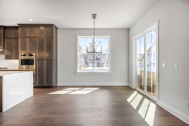 5636 Suffolk Ct, West Bloomfield, MI 48322 - unfurnished dining area with dark wood finished floors, plenty of natural light, baseboards, and recessed lighting