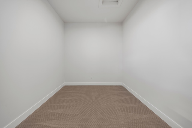 5636 Suffolk Ct, West Bloomfield, MI 48322 - carpeted empty room with baseboards and attic access