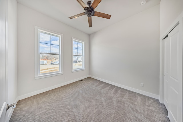 5636 Suffolk Ct, West Bloomfield, MI 48322 - unfurnished bedroom featuring carpet, baseboards, a closet, and a ceiling fan