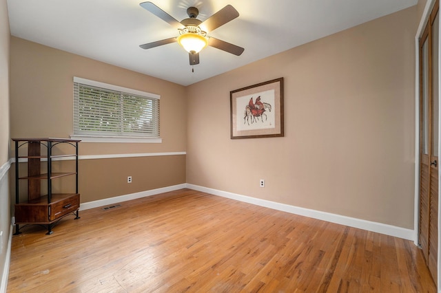 33466 Brownlea Dr, Sterling Heights, MI 48312 - unfurnished room with light wood-style floors, baseboards, and ceiling fan