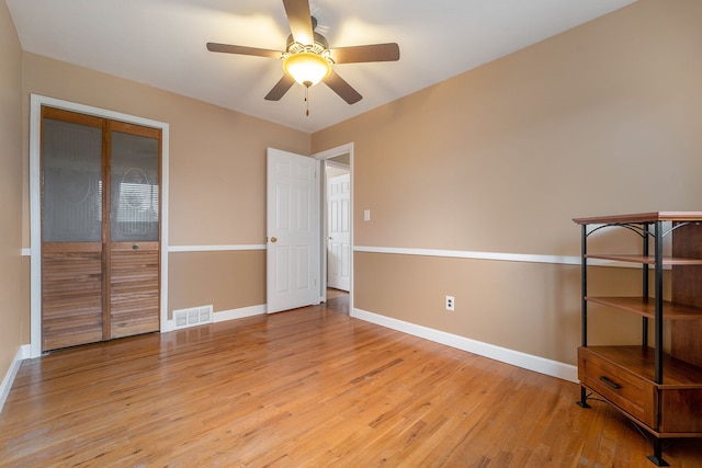 33466 Brownlea Dr, Sterling Heights, MI 48312 - unfurnished bedroom featuring baseboards, light wood-style floors, ceiling fan, and a closet