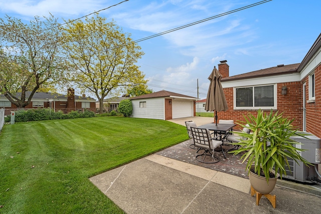 33466 Brownlea Dr, Sterling Heights, MI 48312 - view of grassy yard with an outdoor structure, a garage, a patio, and outdoor dining area