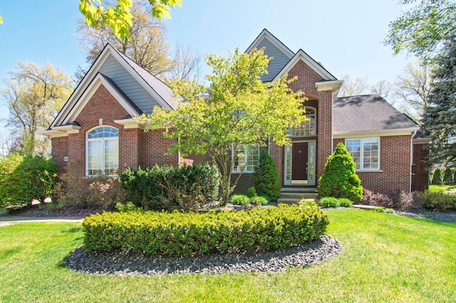194 W Reed Lk, Commerce Twp, MI 48390 - traditional home with brick siding and a front yard