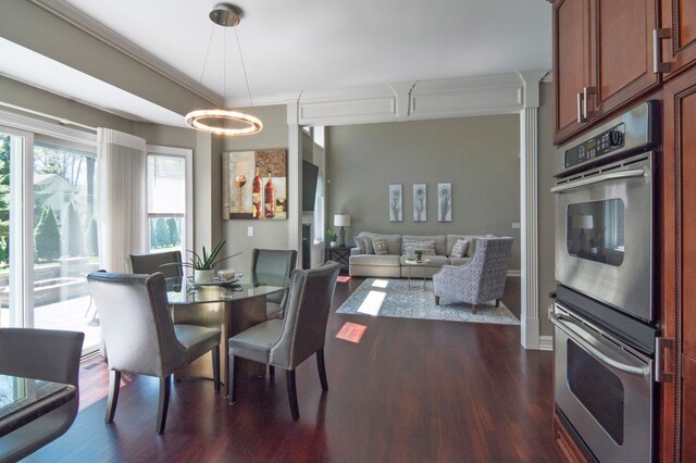 194 W Reed Lk, Commerce Twp, MI 48390 - dining space featuring dark wood finished floors and crown molding